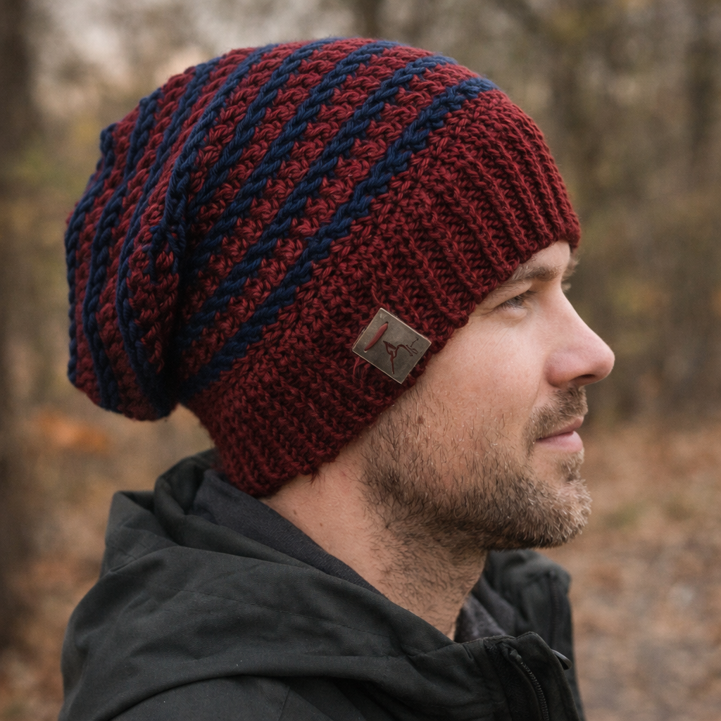 Man wearing a red and blue striped knit beanie outdoors